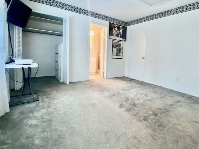 unfurnished bedroom with carpet floors