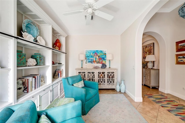 sitting room featuring ceiling fan and light tile patterned flooring