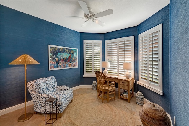 tiled home office featuring ceiling fan