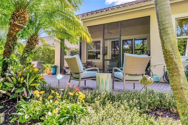 view of patio featuring a sunroom