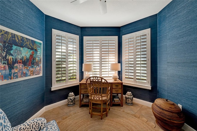 interior space featuring ceiling fan and light tile patterned floors