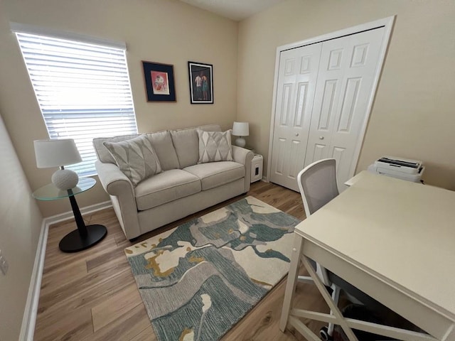 office space with light wood-type flooring