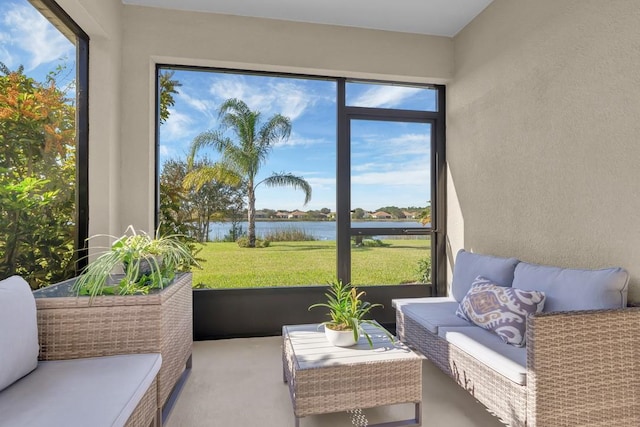 sunroom with a water view