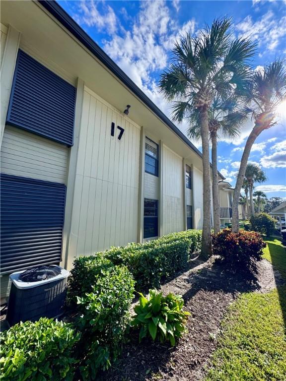 view of side of home featuring cooling unit