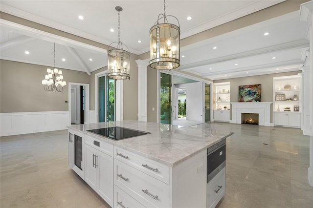765 Azalea Ln, Vero Beach, FL 32963 - kitchen with a chandelier, crown molding, black electric stovetop, a center island, and open floor plan