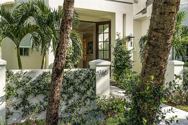 765 Azalea Ln, Vero Beach, FL 32963 - entrance to property featuring stucco siding