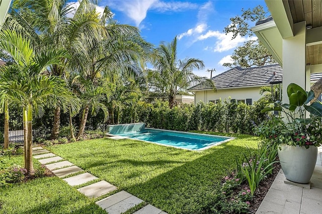 765 Azalea Ln, Vero Beach, FL 32963 - view of swimming pool featuring a lawn