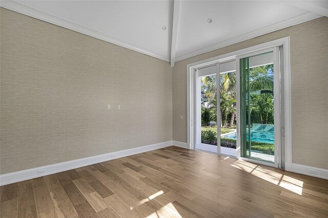 765 Azalea Ln, Vero Beach, FL 32963 - spare room with baseboards, wood finished floors, and crown molding