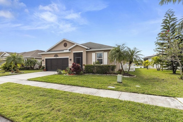 ranch-style house featuring concrete driveway, a front lawn, an attached garage, and stucco siding