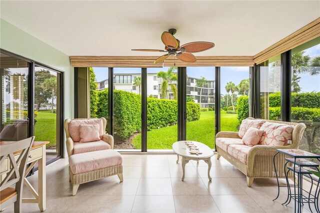 sunroom with a wealth of natural light and ceiling fan