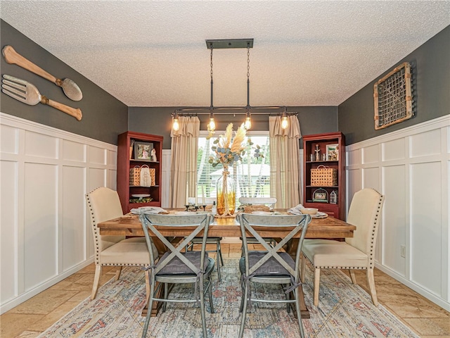 dining room with a textured ceiling