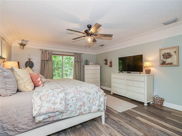 bedroom featuring hardwood / wood-style floors, ceiling fan, crown molding, and a textured ceiling