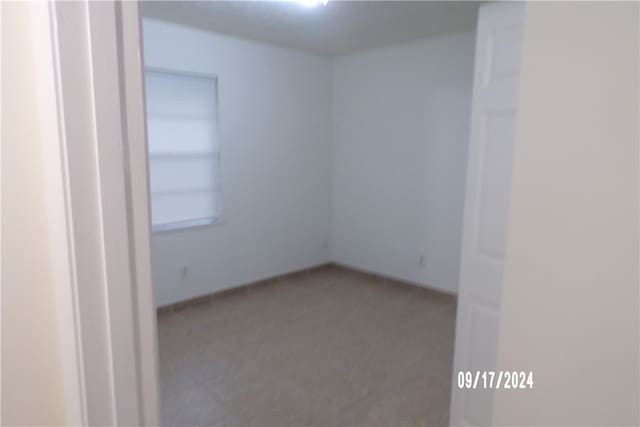 empty room with carpet flooring