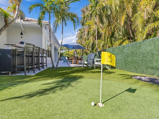 1618 W Sandpointe Pl, Vero Beach, FL 32963 - view of yard with an area to practice putting and a patio