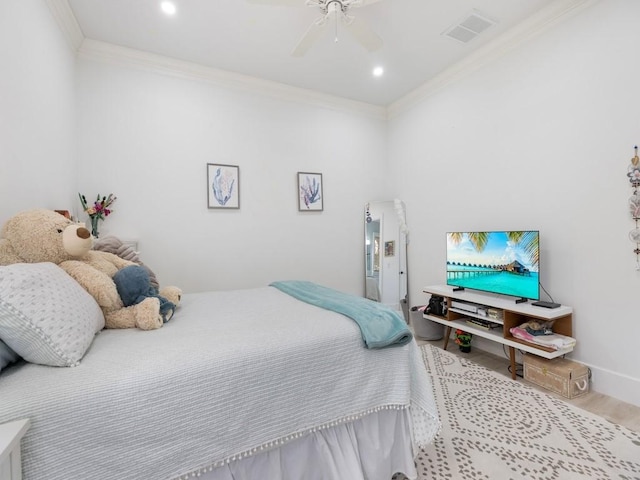 1618 W Sandpointe Pl, Vero Beach, FL 32963 - bedroom with crown molding, wood finished floors, ceiling fan, and recessed lighting