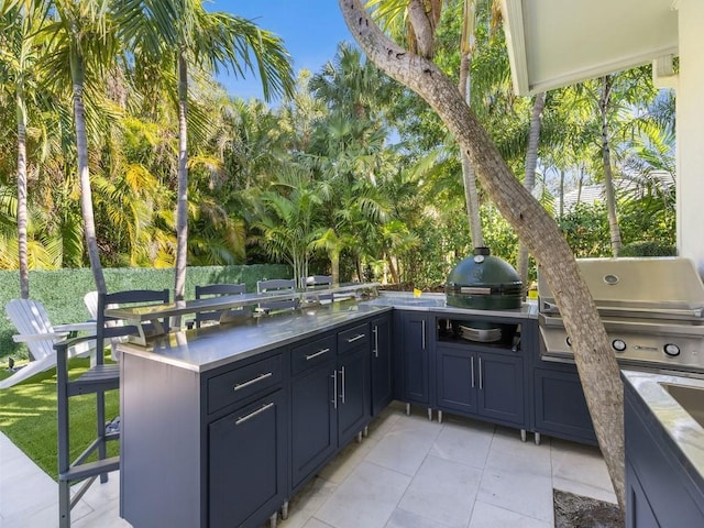 1618 W Sandpointe Pl, Vero Beach, FL 32963 - view of patio with an outdoor kitchen