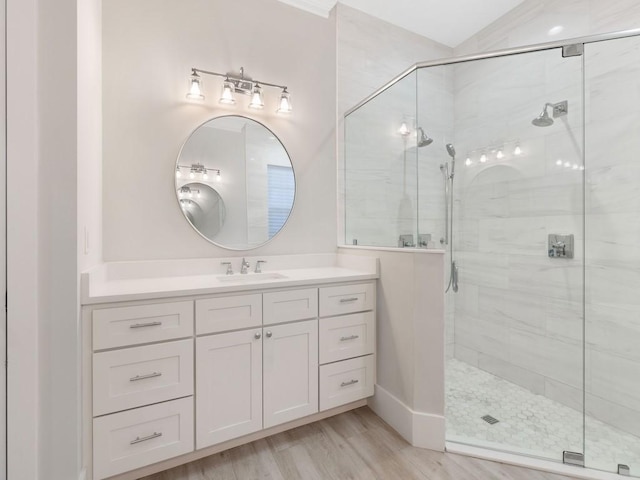 1618 W Sandpointe Pl, Vero Beach, FL 32963 - bathroom with a stall shower, vanity, and wood finished floors