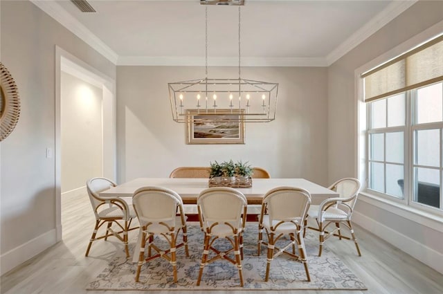 1618 W Sandpointe Pl, Vero Beach, FL 32963 - dining room with wood finished floors, crown molding, and a chandelier