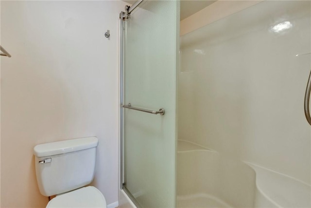 full bath with a shower stall and toilet