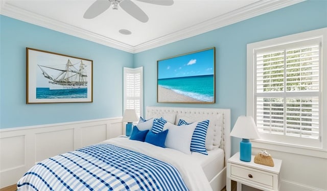 bedroom featuring ceiling fan and ornamental molding