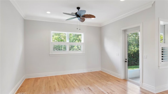 unfurnished room with light wood-type flooring, ornamental molding, and a wealth of natural light