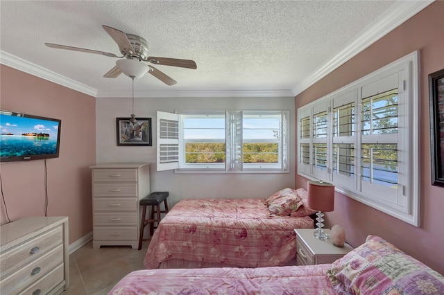 tiled bedroom featuring a textured ceiling, ceiling fan, and crown molding