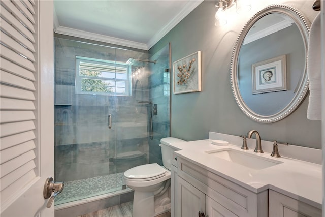 bathroom featuring toilet, hardwood / wood-style floors, ornamental molding, an enclosed shower, and vanity