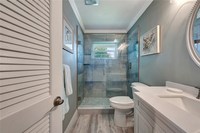 bathroom with walk in shower, toilet, hardwood / wood-style flooring, and ornamental molding