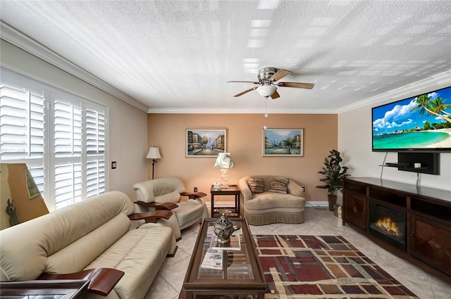 tiled living room featuring a textured ceiling, ceiling fan, and crown molding