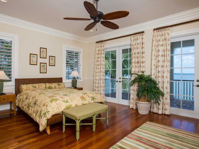 bedroom featuring french doors, dark hardwood / wood-style floors, multiple windows, and access to outside