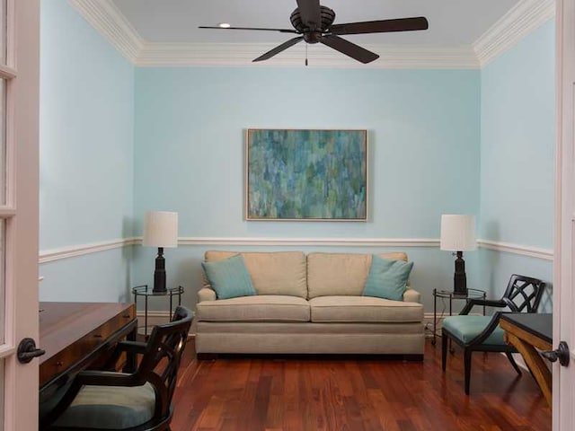 living room with crown molding, ceiling fan, and dark hardwood / wood-style flooring