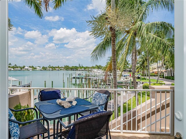 balcony featuring a water view