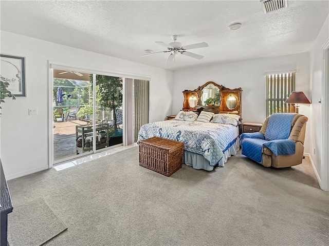 5207 Indian Bend Ln, Fort Pierce, FL 34951 - bedroom with carpet flooring, ceiling fan, access to outside, visible vents, and a textured ceiling