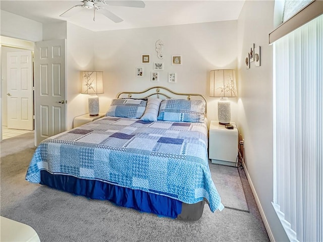 bedroom with carpet, ceiling fan, and baseboards
