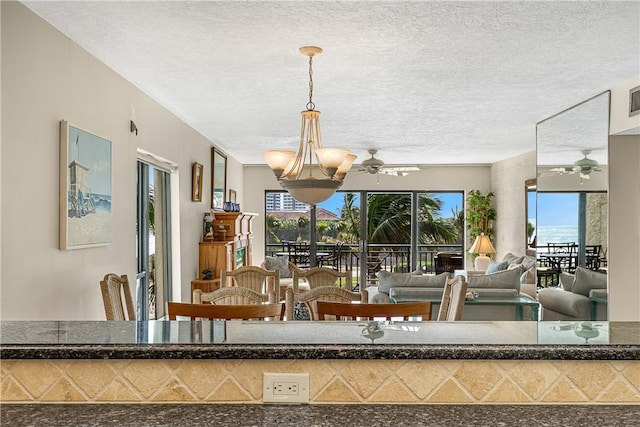 dining room with a textured ceiling