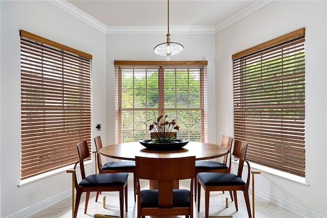 dining area with light tile patterned floors and ornamental molding