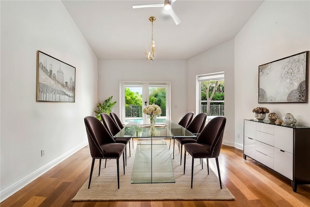 dining room featuring ceiling fan, light wood-type flooring, and french doors