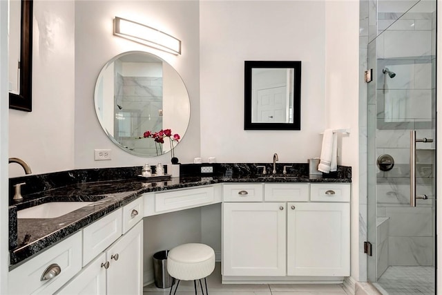 bathroom with vanity and walk in shower