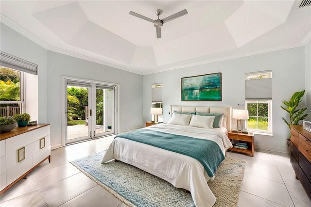 tiled bedroom featuring access to outside, french doors, a raised ceiling, crown molding, and ceiling fan