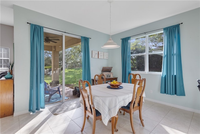 dining area with light tile patterned flooring and ceiling fan