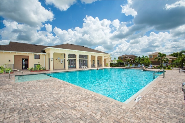 view of swimming pool featuring a patio area