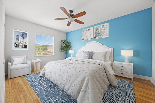 bedroom featuring ceiling fan and wood-type flooring