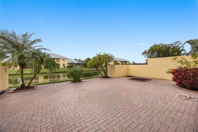 view of patio / terrace with a water view