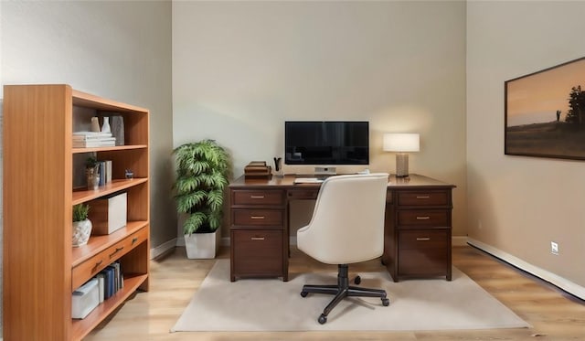 office with light hardwood / wood-style floors