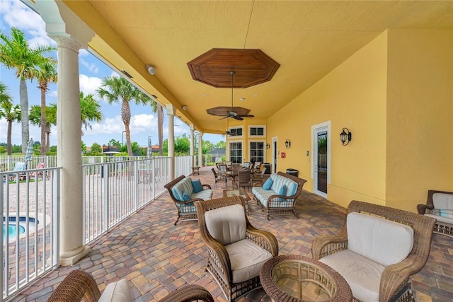 view of patio / terrace with an outdoor living space and ceiling fan