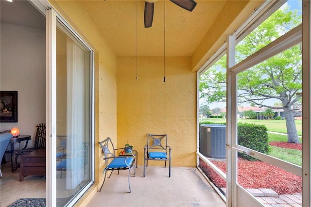 sunroom / solarium with ceiling fan