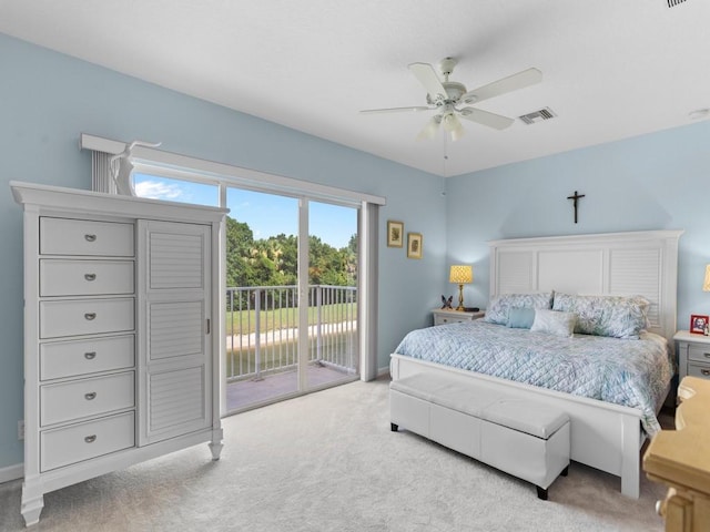 carpeted bedroom with visible vents, baseboards, a ceiling fan, and access to outside