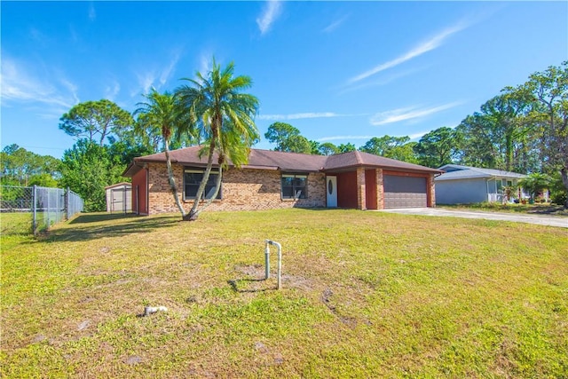 single story home featuring fence, a garage, concrete driveway, brick siding, and a front lawn