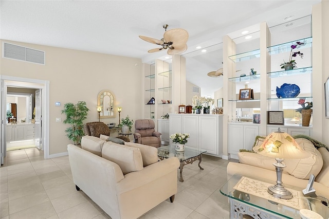 living room with light tile patterned floors, high vaulted ceiling, and ceiling fan