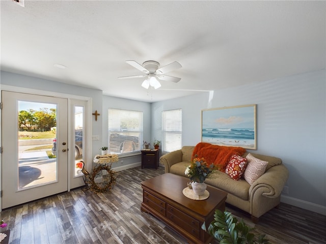 living room featuring ceiling fan, dark hardwood / wood-style flooring, and a wealth of natural light